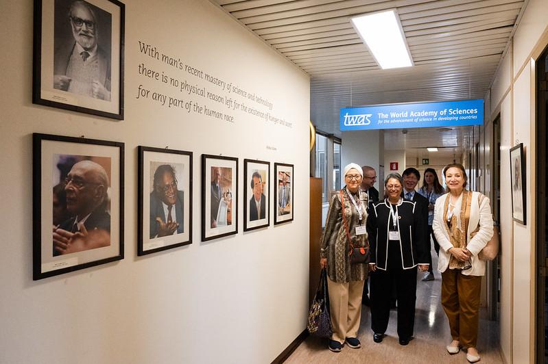 Members of the 2023-2026 TWAS Council at TWAS Headquarters in Trieste, italy, gathered near a wall displaying TWAS presidents throughout history and a quote by TWAS founder Abdus Salam. (Photo: G. Ortolani/TWAS)