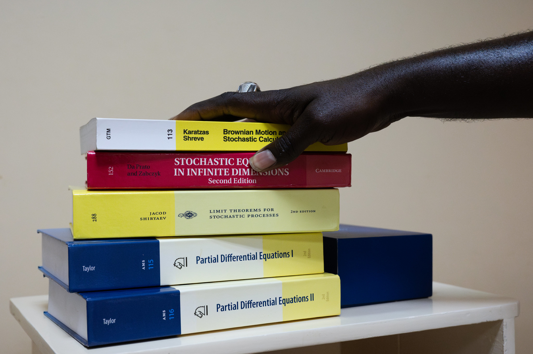 Moustapha Dieye, Lecturer at the Ecole Polytechnique de Thiès, Senegal, and some of the books he purchased thanks to a TWAS Research Grant (Photo: G.Ortolani/TWAS).