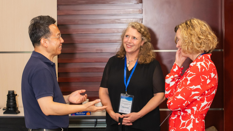 Professor Zhaohui Lin, discussing with Ylann Schemm, the Executive Director of the Elsevier Foundation, and Tracey Brown