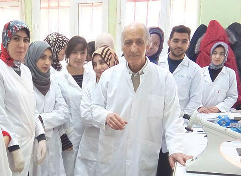 TWAS Fellow Mustapha Benmouna of Algeria with students in his lab. [Photo provided]