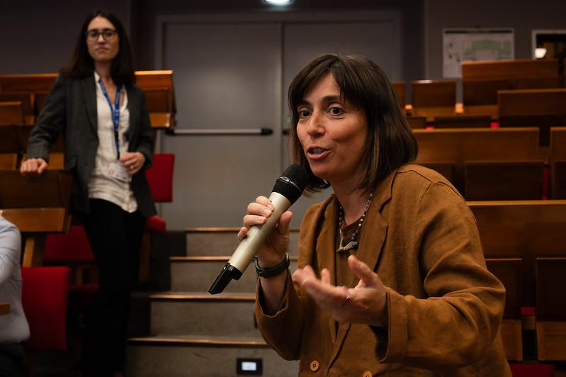 Close-up: Anna Pirani, Senior Research Associate, Euro-Mediterranean Center on Climate Change. In the background: Giulia Gennari, TWAS Associate Programme Officer. (Photo: G. Ortolani/TWAS)