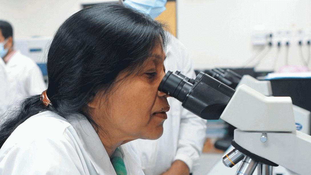 Sayera Banu inspecting samples